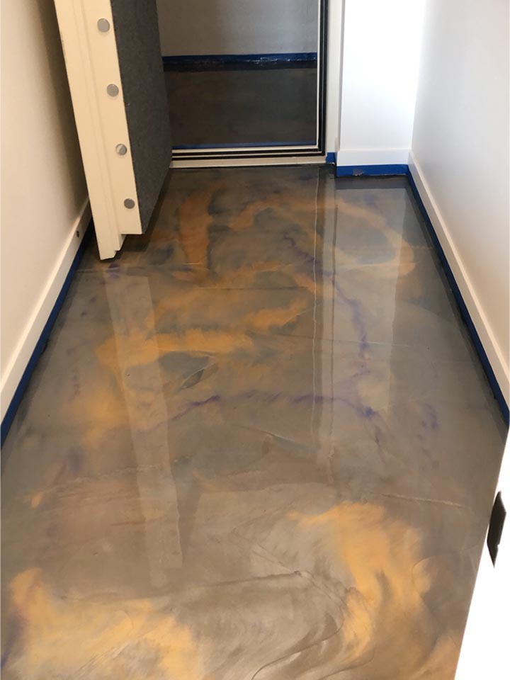 Metallic epoxy floor coating with fluid 3D visual effects