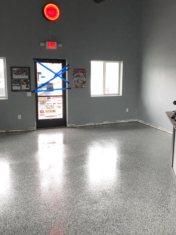 Finished grey and black flake floor in an office shop setting